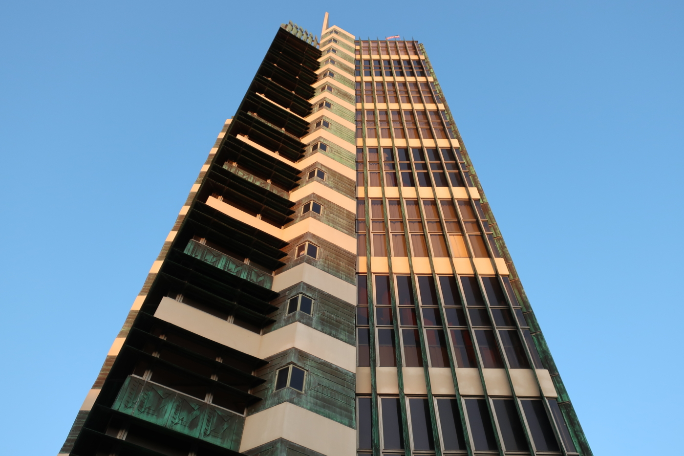 Exterior of Price tower with closeup of copper detail